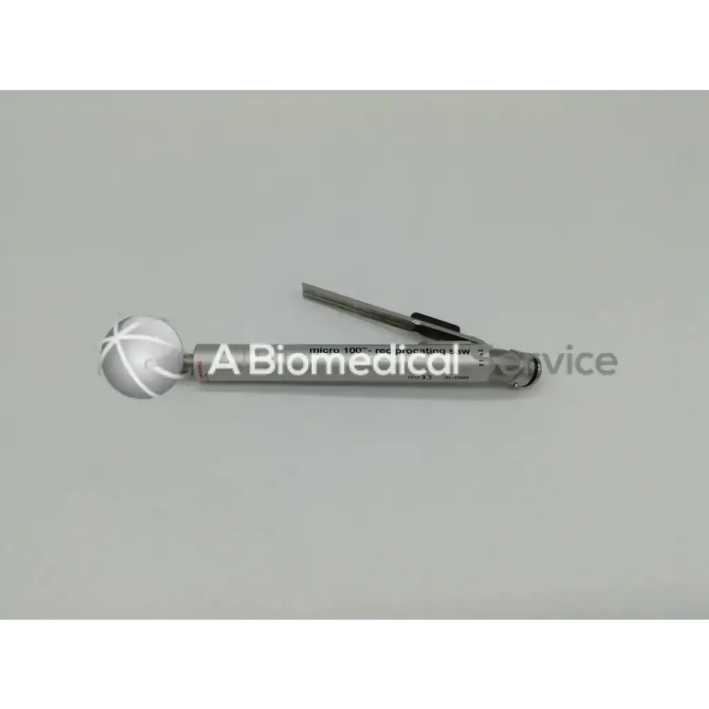 Silver metallic zimmer linvatec hall micro 100 pneumatic surgairtome two instrument with spherical end and engraved text