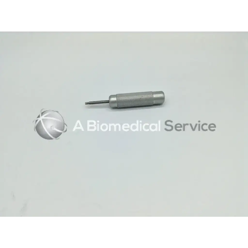 Silver metal punch tool with textured grip and pointed tip from zimmer linvatec hall surgairtome two set