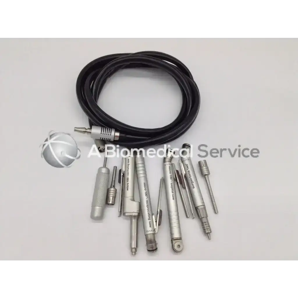 Set of silver zimmer linvatec hall surgical instruments with black coiled air hose for surgairtome two pneumatic use