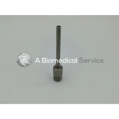 A sleek metallic surgairtome two with cylindrical shaft and threaded base from zimmer linvatec hall micro 100 set