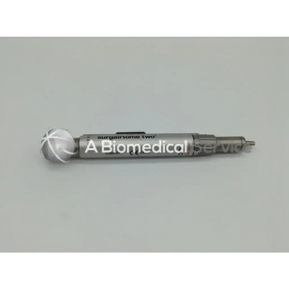Silver metallic surgairtome two with spherical cross-hatched head in zimmer linvatec hall micro 100 pneumatic set