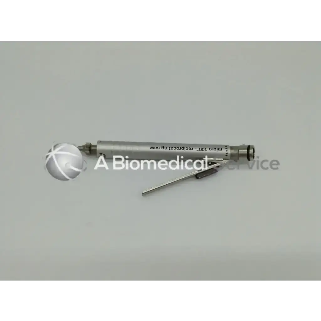 Silver cylindrical micro surgical saw with spherical handle and blade in zimmer linvatec hall surgairtome two set