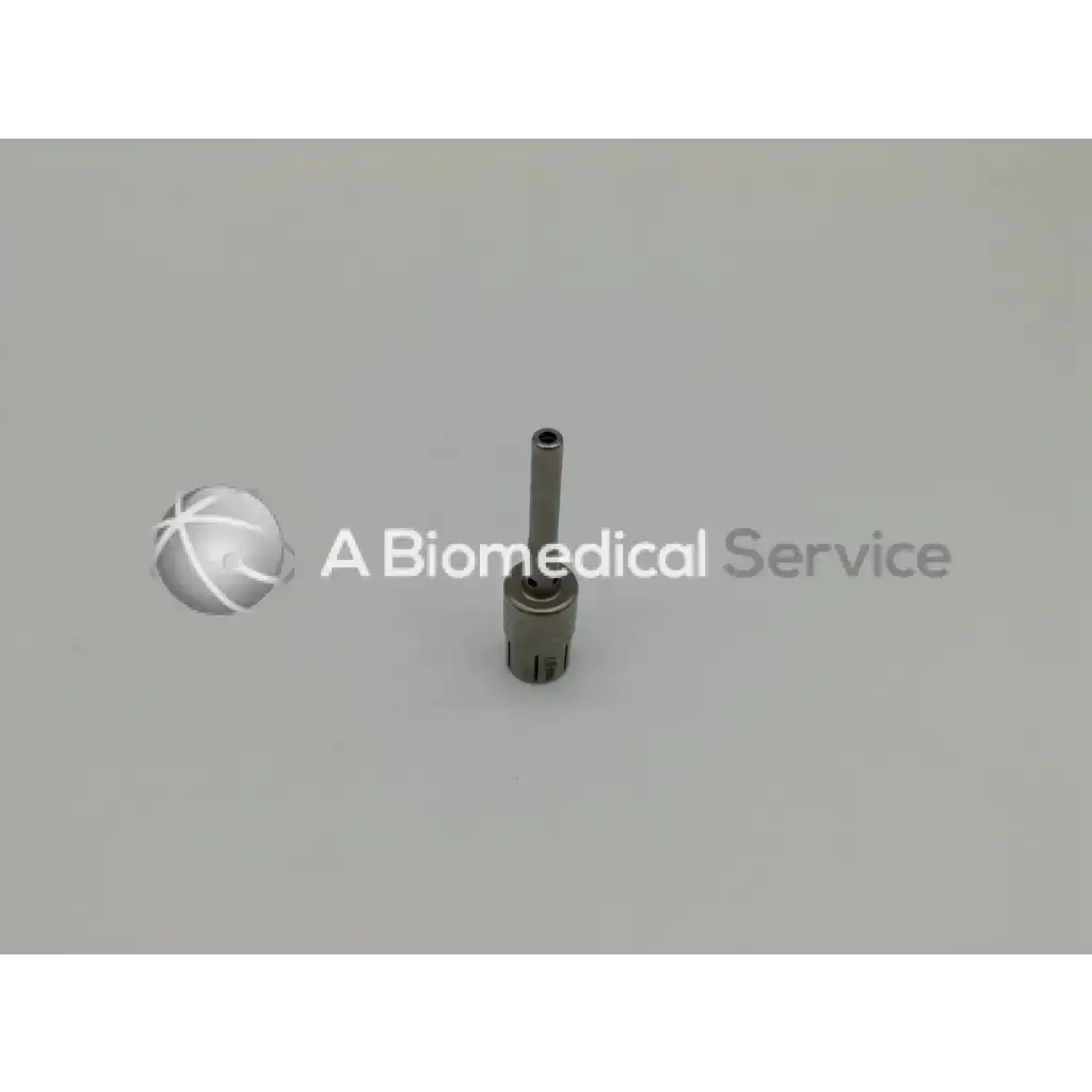 Silver metallic cylindrical medical device with threaded base from zimmer linvatec hall surgairtome two set
