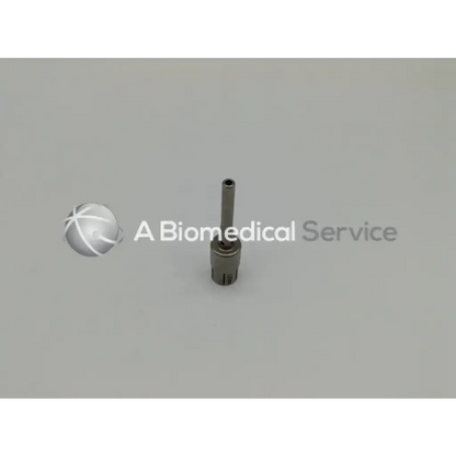 Silver metallic cylindrical medical device with threaded base from zimmer linvatec hall surgairtome two set