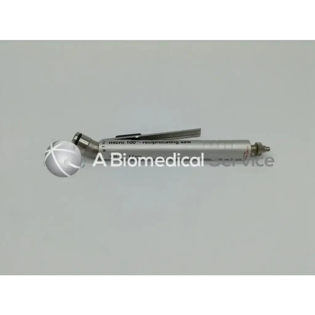 Silver-colored zimmer linvatec hall micro 100 pneumatic reciprocating saw with metallic handle and adjustable blade mechanism