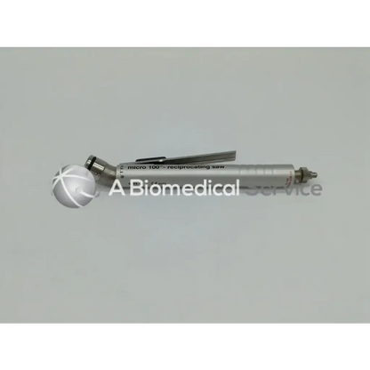 Silver-colored zimmer linvatec hall micro 100 pneumatic reciprocating saw with metallic handle and adjustable blade mechanism