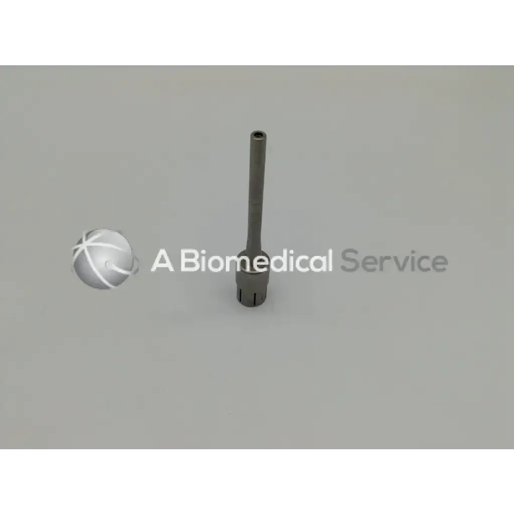 Silver metallic surgical instrument with cylindrical shaft and fluted base from zimmer linvatec hall surgairtome two set