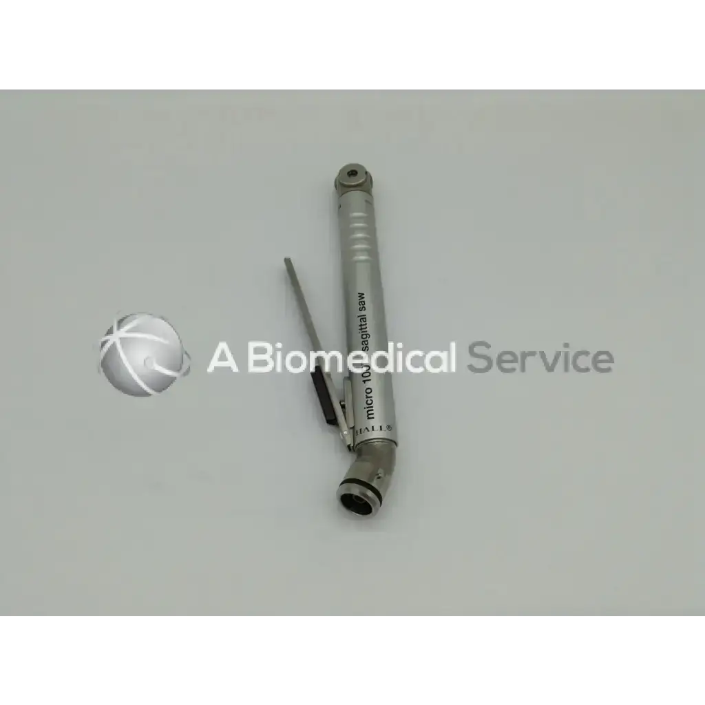 Silver metallic micro 10 sagittal saw with engraved text from zimmer linvatec hall surgairtome two pneumatic set