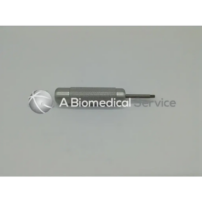 Silver-colored metallic surgairtome two with textured grip and pointed tip in zimmer linvatec hall micro 100 pneumatic set