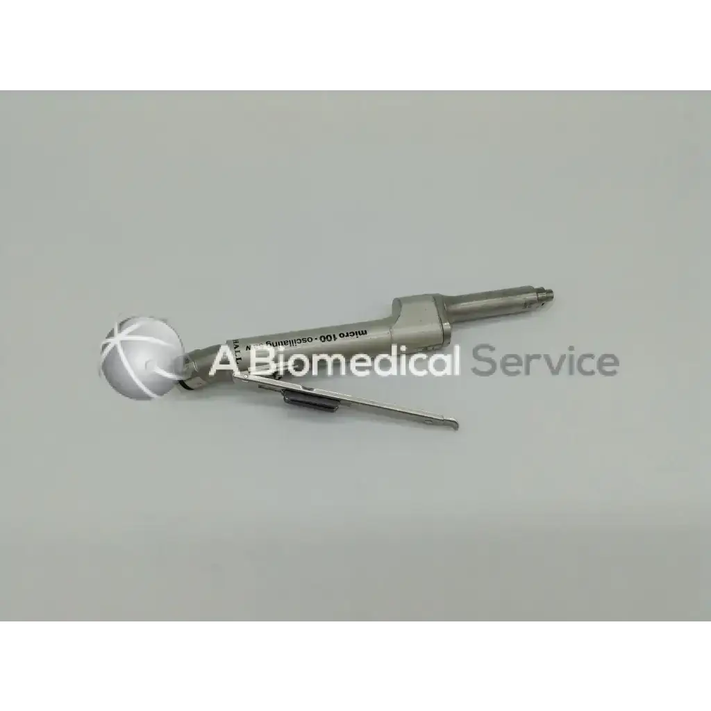 Silver surgical instrument with spherical head and engraved text from zimmer linvatec hall used in surgairtome two set