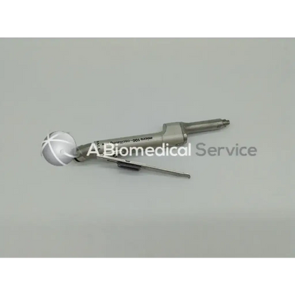 Silver surgical instrument with spherical head and engraved text from zimmer linvatec hall used in surgairtome two set