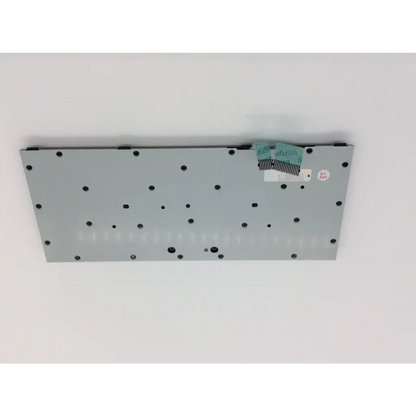 Gray rectangular electronic component with black screw holes and green ribbon cable attached on the back of zippy k1-20a2-us02 keyboard