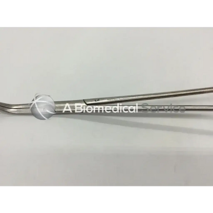 Stainless steel surgical forceps with clamp angled offset and textured grip featuring a curved tip for precision