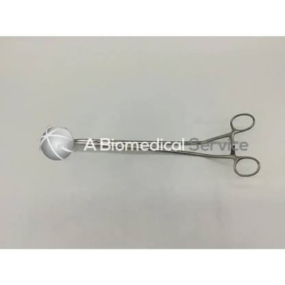 Silver surgical forceps with clamp angled offset handle and spherical translucent head featuring white crosshatch markings