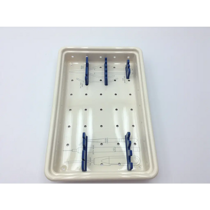 Cream-colored ceramic surgical instrument tray with blue holders in ascension forefoot set csa-800-01 forefoot set