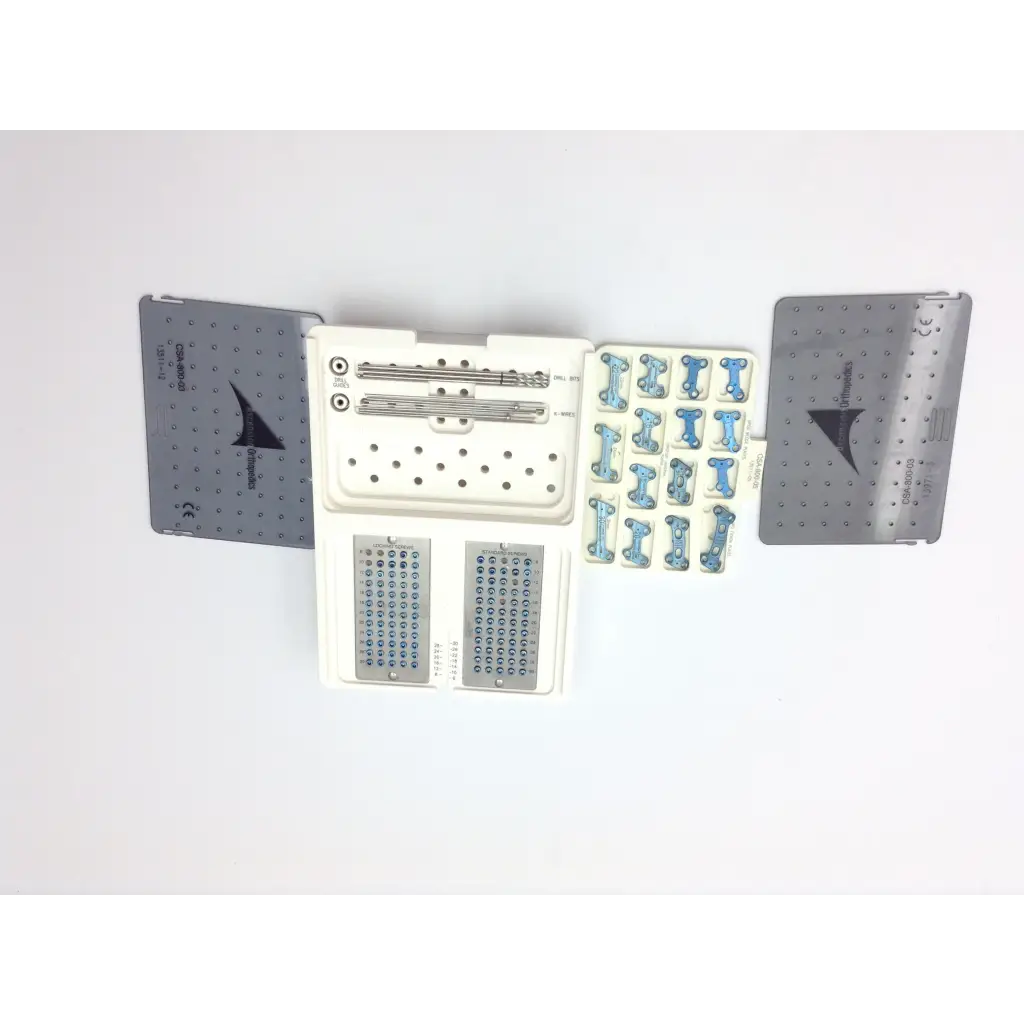 Medical orthopedic surgical kit with metallic plates screws and blue bone fixation parts in a white tray ascension forefoot set