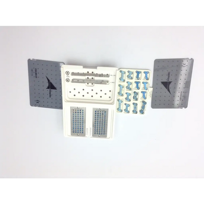 Medical orthopedic surgical kit with metallic plates screws and blue bone fixation parts in a white tray ascension forefoot set