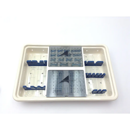 Beige plastic surgical instrument tray with gray metal plates and blue holders in the ascension forefoot set csa-800-01 set