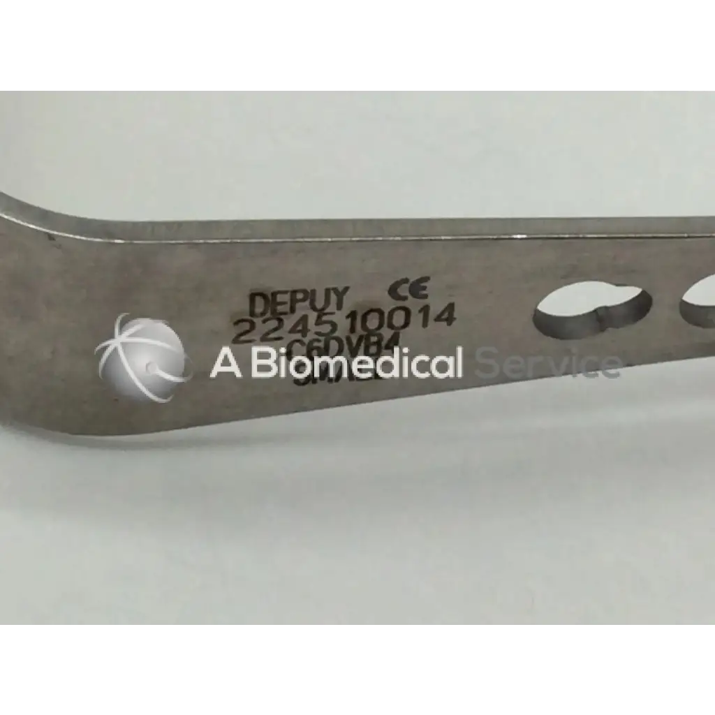 Silver metallic depuy 224510014 surgical retractor small with engraved markings and circular cutouts