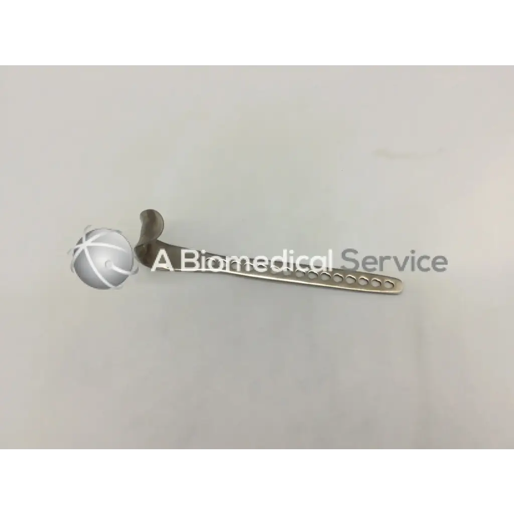 Depuy 224510014 surgical retractor small with silver textured handle and slender blade featuring circular cutouts