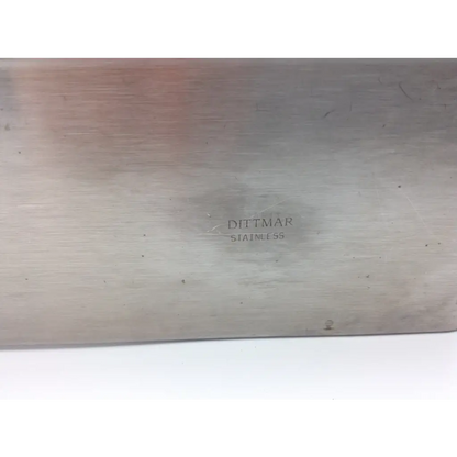 A dittmar stainless tray cutting board with a brushed metallic finish in stainless steel material
