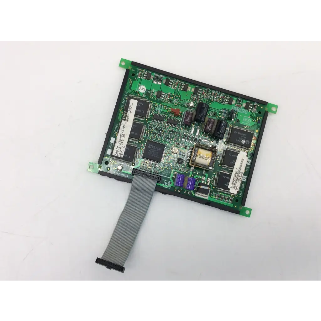 Green circuit board with black integrated circuits and gray ribbon cable of el320.240.36 display planar bbcc1-8 back side