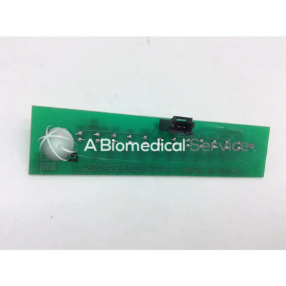 Green rectangular circuit board with black connectors and white logo for GE Marquette Dash 4000 alarm light assembly
