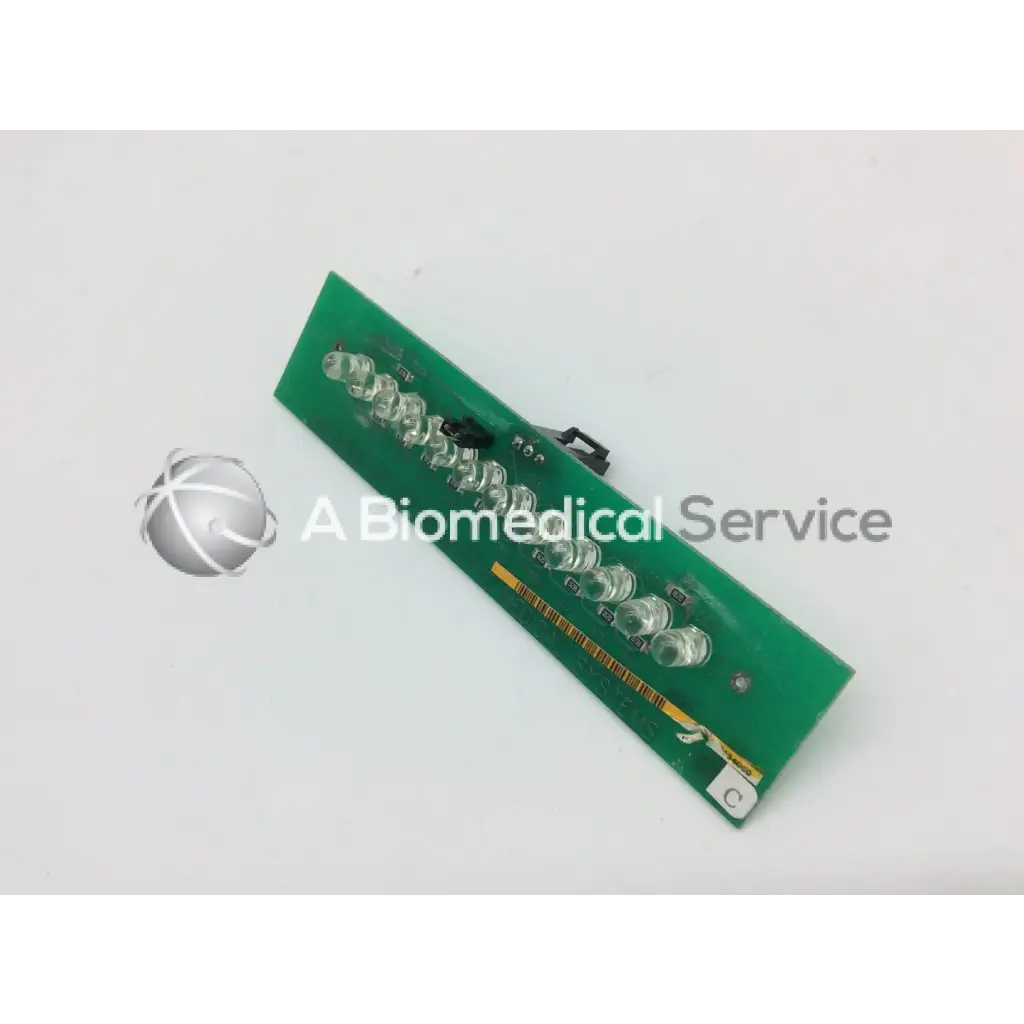Green rectangular circuit board with clear led lights and black connectors for ge marquette dash 4000 alarm light assembly