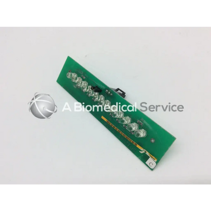 Green rectangular circuit board with clear led lights and black connectors for ge marquette dash 4000 alarm light assembly
