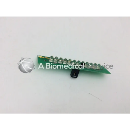 Green circuit board with clear led lights and black component for ge marquette dash 4000 alarm light assembly