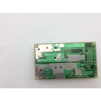 Green rectangular circuit board with silver metallic components and soldered traces in ge medical system power supply unit 226589d