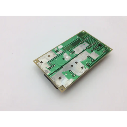 Green rectangular circuit board with silver soldered components in GE medical system power supply unit 226589d