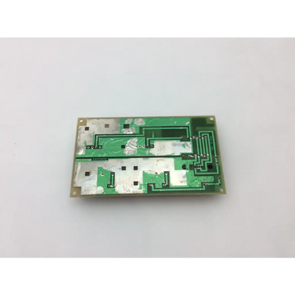 Green rectangular circuit board with silver soldered components and white patches in ge medical system power supply unit 226589d