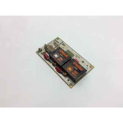 Black rectangular GE Medical System power supply unit 226589d with orange branding and copper coils on circuit board