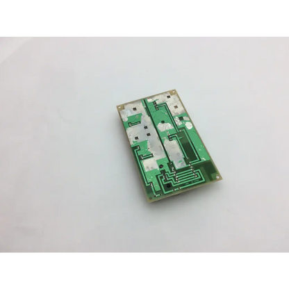 Green rectangular circuit board with copper traces and solder pads for GE medical system power supply unit 226589d