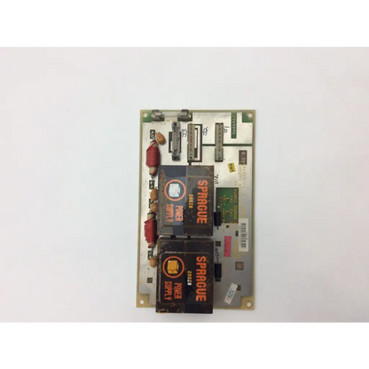 Sparcure power supply unit 226589d with black rectangular components and red coil inductors on green circuit board for GE Medical System