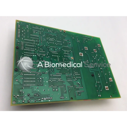 Green rectangular printed circuit board with intricate copper traces and soldered components for plus fil kvp control board
