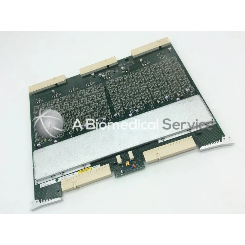 Green circuit board with silver metallic heat sink and beige connectors in GE vivid 9 dimension ultrasound fc200057-05 rev board
