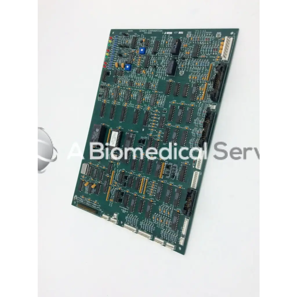Green printed circuit board with black integrated circuits and blue capacitors for gendex 9000 xray x-ray circuit board 124-0229