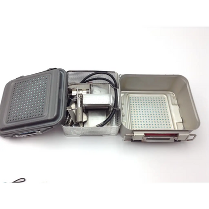 Gray perforated metal genesis case sterilization container with mesh interior and handle for surgical instruments