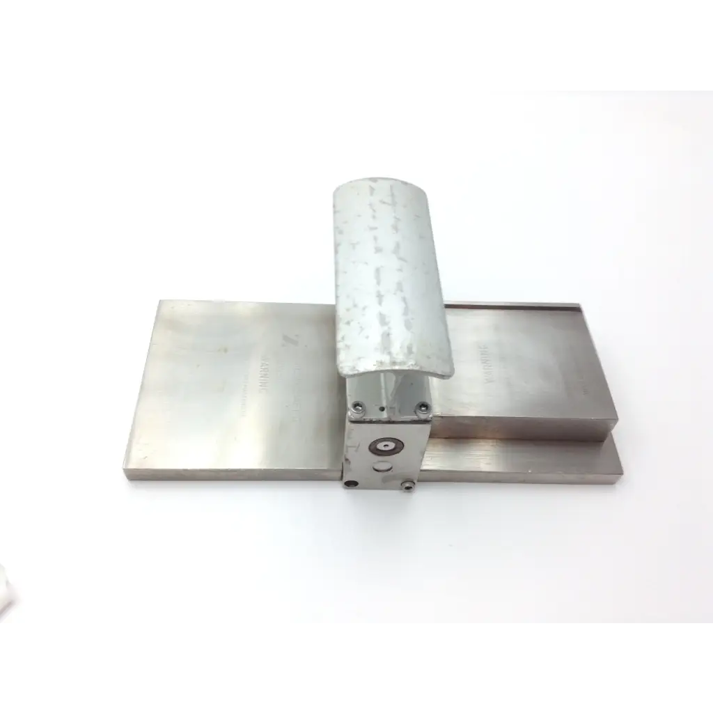 Silver metallic genesis case sterilization container with rectangular base cylindrical handle and central circular component