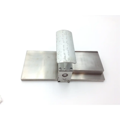 Silver metallic genesis case sterilization container with rectangular base cylindrical handle and central circular component