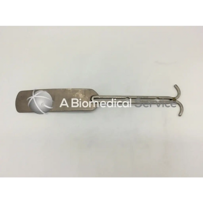 Silver metallic balfour abdominal retractor with flat rounded handle and curved end surgical medical instrument