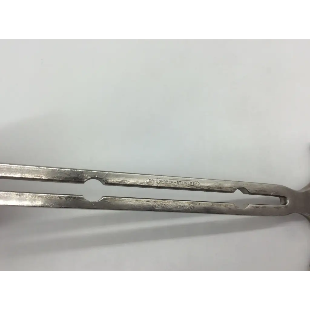 Silver stainless steel balfour abdominal retractor tongs with polished worn finish and engraved branding
