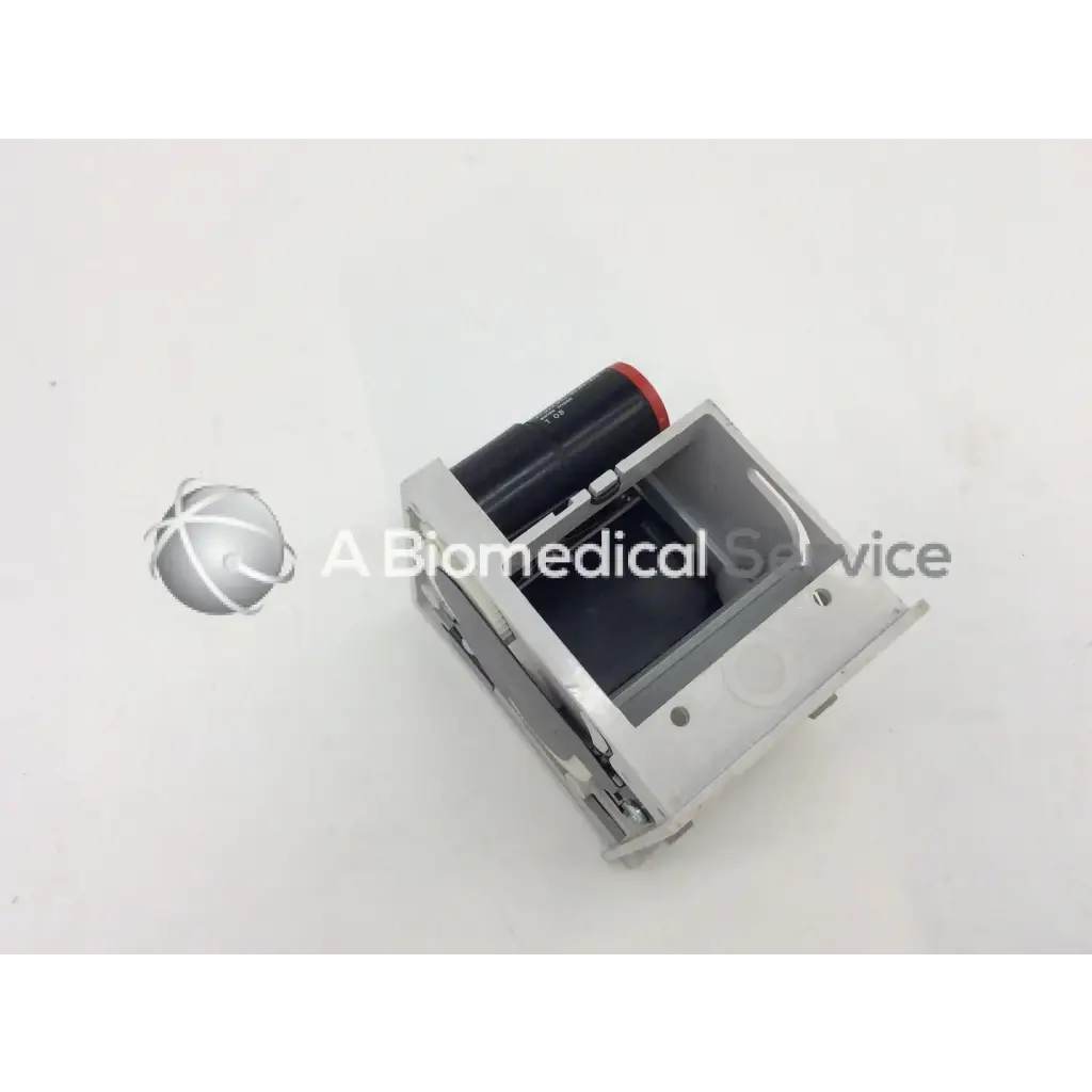 Silver metallic gsi lumonics hot dot recorder module with black cylindrical component and red cap housing
