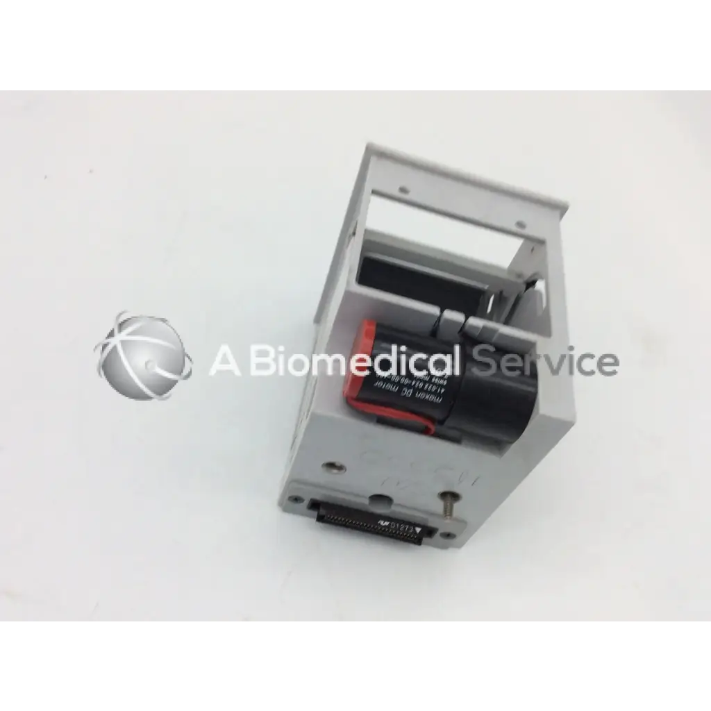 Gray plastic housing of gsi lumonics hot dot recorder module with black and red internal component visible
