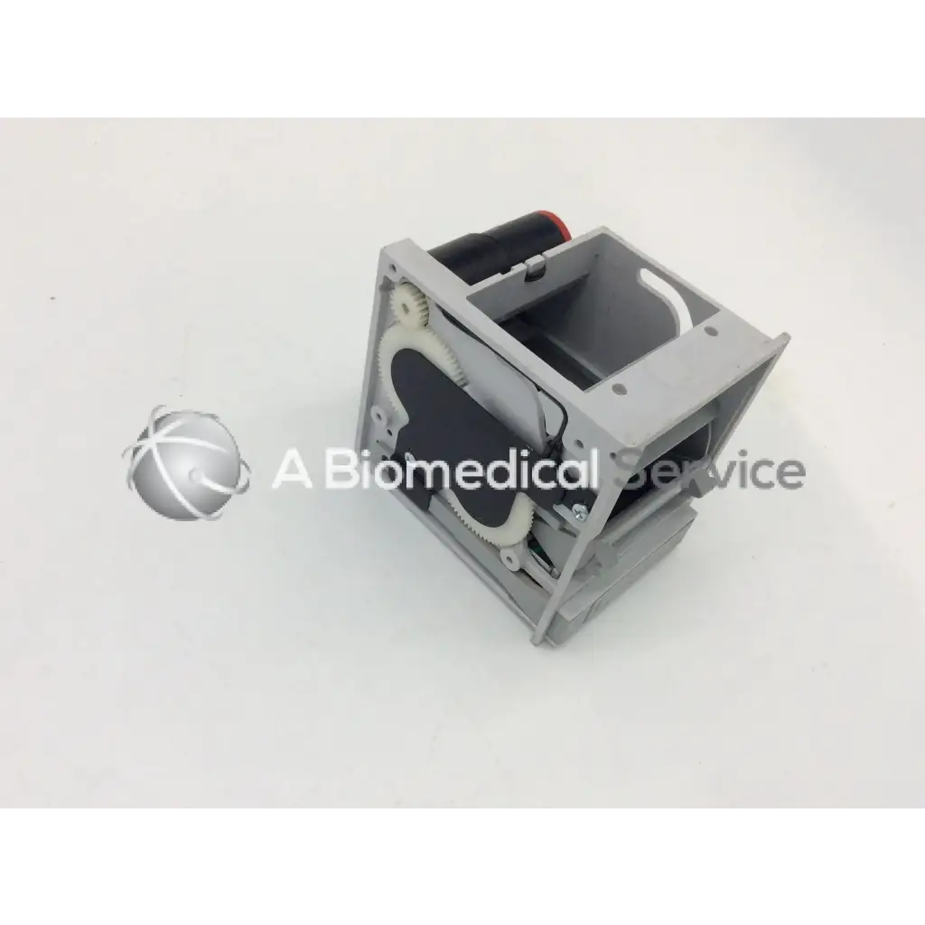 Gray plastic gsi lumonics hot dot recorder module housing with internal gears and a black cylindrical component