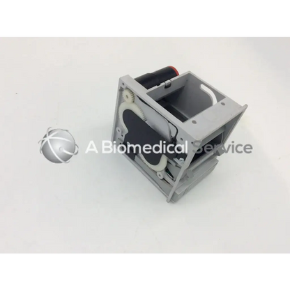 Gray plastic gsi lumonics hot dot recorder module housing with internal gears and a black cylindrical component