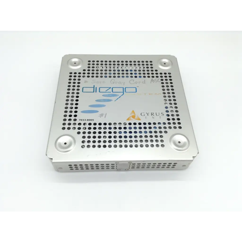 Silver perforated metal surgical instrument tray with diego shaver handpiece and gyrus acmi branding