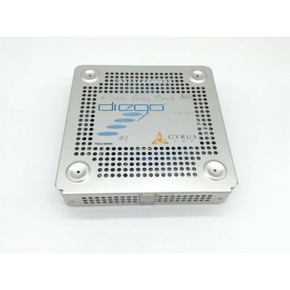 Silver perforated metal surgical instrument tray with diego shaver handpiece and gyrus acmi branding